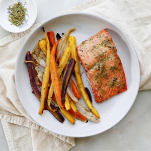 White plan with PCOS sheet pan meal of maple mustard salmon with glazed carrots.